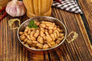Baked white canned beans in the bowl