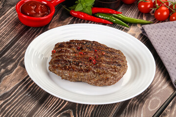 Grilled beef burger cutlet with sauce