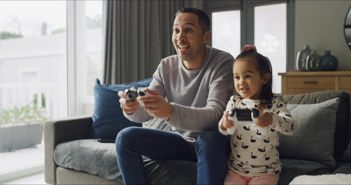 Relax, video game and father with child on sofa for bonding, playing and connection in living room. Happy, controller and dad with girl kid for online gaming together on weekend break in home.