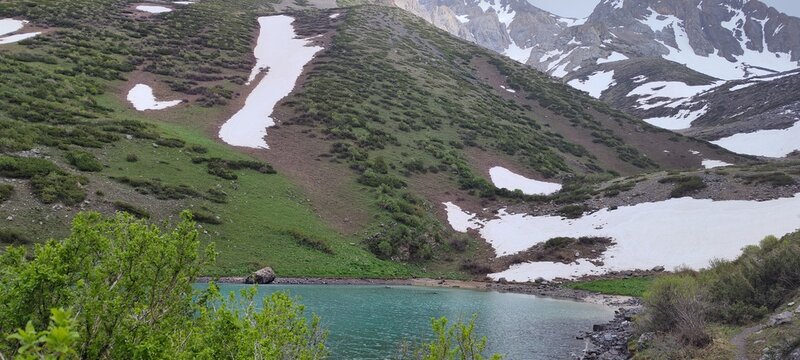 Lower lake in the mountains of Sairam-Ugamsky National Park in the Republic of Kazakhstan, Shymkent city, Sairam-Su gorge. At an altitude of 2350 meters above sea level.