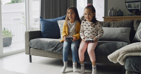 Home, happy kids and play video game for competition, contest and entertainment on sofa. Sisters, girls and children with console for gaming challenge, hobby and relax together with family in lounge
