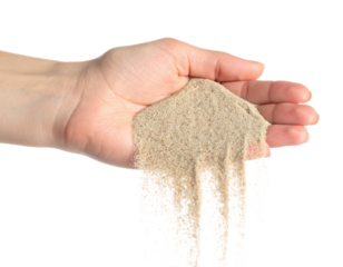 Human Hand Holding Fine Sand Pouring Down Falling isolated on transparent background. PNG die-cut for advertising