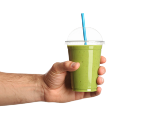 Male Hand Holding A Clear Cup With Green Smoothie And Blue Straw Drink Beverage isolated on transparent background. PNG die-cut for advertising