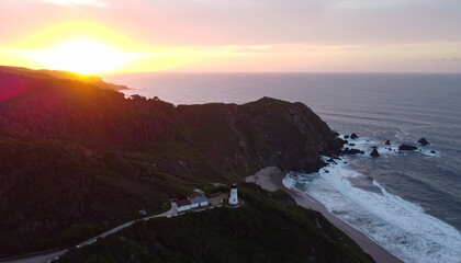 Fototapeta premium Coastal Sunset Panorama: The sun dips below the horizon, casting a golden glow over a rugged coastline, a serene seascape inviting contemplation and wonder. 