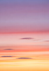 Fototapeta premium Beautiful, dramatic orange and red sunset over the sea with a vibrant cloudscape