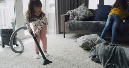 Cleaning, vacuum cleaner and help with kids in living room for hygiene, support or domestic chores. Dust prevention, sanitary or housekeeping with siblings or children in family home for maintenance
