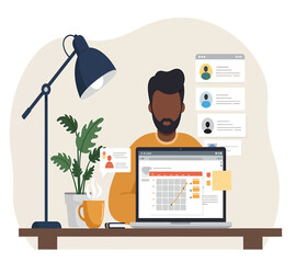 Focused businessman analyzing growth charts on laptop in modern home office setting