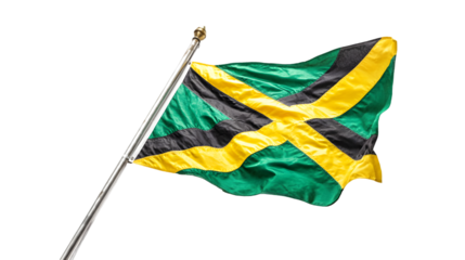 A jamaican flag waving against a black background with a silver pole on the left side of the image