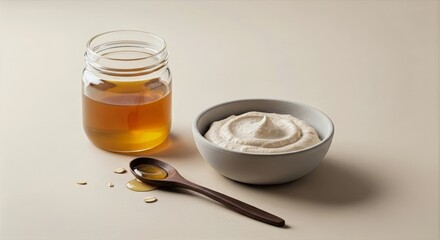 Warm golden honey and oatmeal face mask blend in ceramic bowl with wooden spoon on soft neutral background