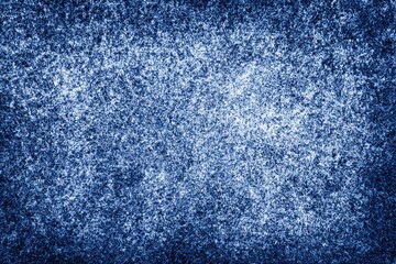 Close-up of textured, faded denim fabric