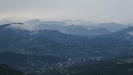 A tranquil scene of layered misty mountains and dense forests, perfect for travel promotions, nature-themed ads, and wellness campaigns