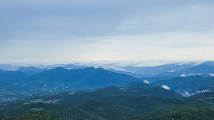 A tranquil scene of layered misty mountains and dense forests, perfect for travel promotions, nature-themed ads, and wellness campaigns