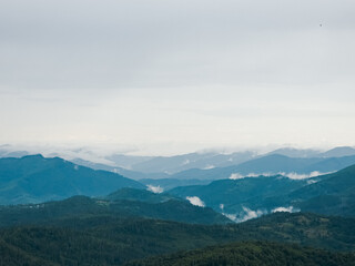 A tranquil scene of layered misty mountains and dense forests, perfect for travel promotions, nature-themed ads, and wellness campaigns