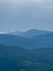 A tranquil scene of layered misty mountains and dense forests, perfect for travel promotions, nature-themed ads, and wellness campaigns