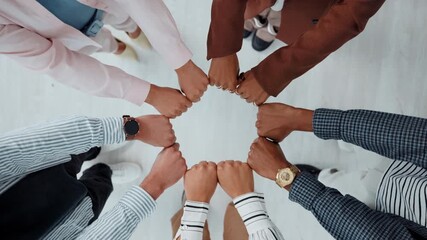 Business, group or hands of people with fist bump for team building, office community or solidarity. Above, diversity and employees in circle for company unity, cooperation and connection in meeting - Powered by Adobe
