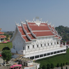 Wat Huay Pla Kang,Figures and houses at the giant white buddha in Chiang Rai, Thailand