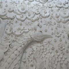 Wat Huay Pla Kang,Figures and houses at the giant white buddha in Chiang Rai, Thailand