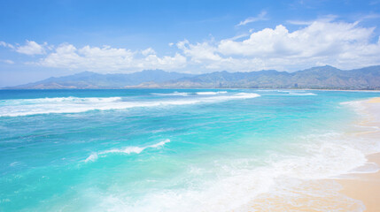 Obraz premium Luxurious tropical resort overlooking golden sand and turquoise waters with mountain backdrop