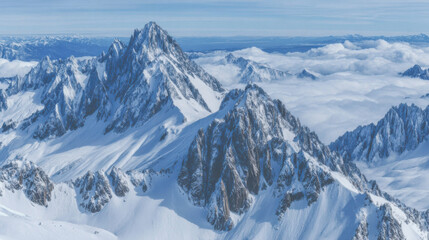 Obraz premium Majestic alpine mountains with snowy summits towering above a sea of clouds