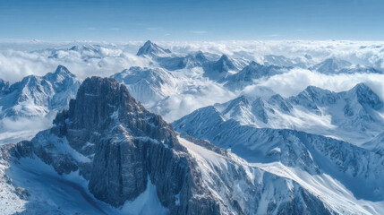 Obraz premium Snow-covered mountain peaks create a striking landscape in a serene, winter sky