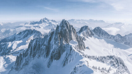 Majestic mountain peaks rise under a clear sky in winter landscape