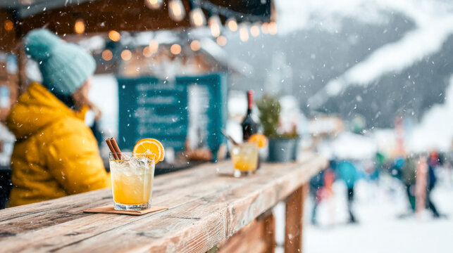 Enjoying drinks at a cozy outdoor snow bar in a ski resort surrounded by winter activities