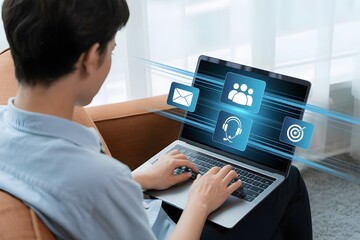 Young man using laptop with customer service and communication icons showcasing online support email marketing teamwork and targeting for business growth and digital solutions