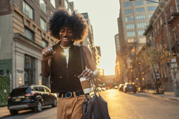 Happy young man strolling in the streets