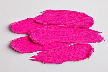 Bright pink makeup smudges on white