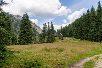 Obraz premium Hikers at a Mountain Hut