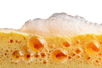 Close-up of frothy, orange-yellow foam with bubbles