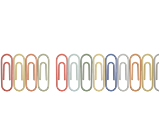 Row of colorful paper clips on black background stationery