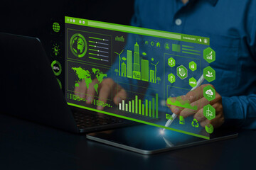 Sustainability development concept. Businessman analyze sustainability investment with KPI Dashboard for ESG, Green businesses, Net zero, Green energy, Green technology, and Carbon credit. CSR. co2.