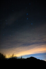 Naklejka premium Milky way stars and rural countryside silhouettes.