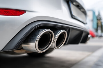 Metallic exhaust pipes close-up, high-performance car detail