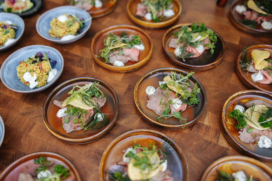 legant Appetizers on Wooden Table &ndash; Fine Event Finger Food