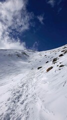 Snowy Mountain Peak with Blue Sky