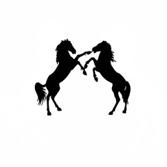 Two horses playing in a side view silhouette