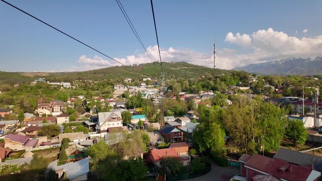 Almaty, Kazakhstan: Point of view of the cable car that rides up the Kok Tobe hill in Almaty, Kazakhstan largest city on a sunny spring day. 