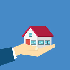 Hand holding house	