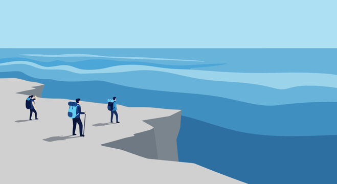 Adventurers Explore Dramatic Coastline Path With Breathtaking Views Of Ocean