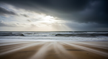 Dramatic stormy sky over a beach with sun rays breaking through