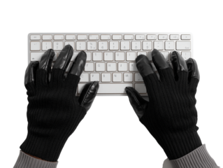 An overhead view captures a pair of hands, adorned in black gloves, actively engaged with a keyboard