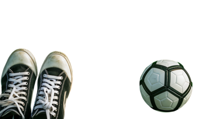 Soccer ball and shoes on dark setting for sports equipment and footwear advertisement or presentation use on transparent background