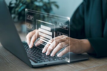 Hands typing on a laptop with a futuristic holographic interface displaying data progress.