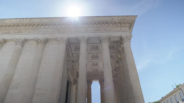 Revealing shot of the Roman Maison Carr&eacute;e with large stone columns