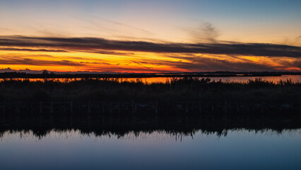 sunset over the lagoon, Po river delta, Comacchio, Ferrara, Italy