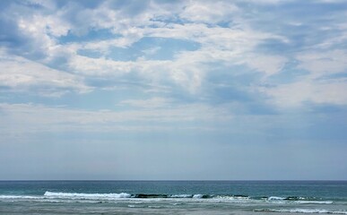 between the clouds and the sea. Clouds drift like messengers of paradise, and nature reveals its...