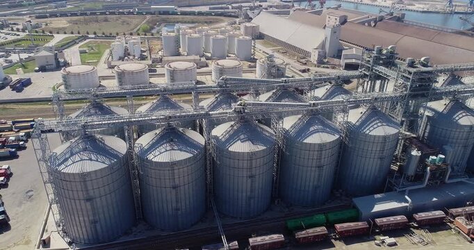 Grain elevator complex. Large grain elevator in the port area, view from above. Grain elevator complex top view. Port grain elevator, aerial view.