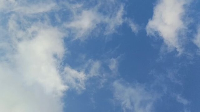 Clouds moving in time-lapse with bule sky